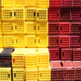 Yellow and red crates are stacked at the Boekenhoutskloof winery in Franschhoek, South Africa.
