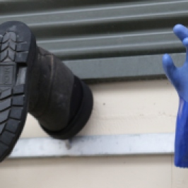 A boot and a glove hang on the wall at the Felton Road winery in New Zealand.