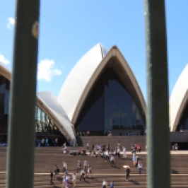Sydney Opera House through some railings.